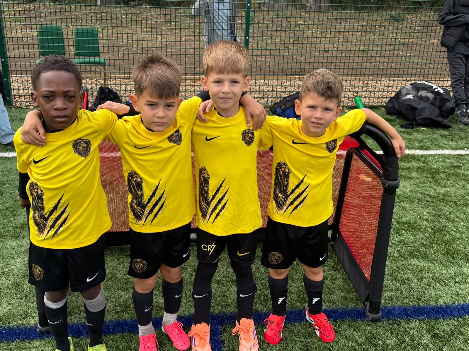 Players in club kit with arms around each other