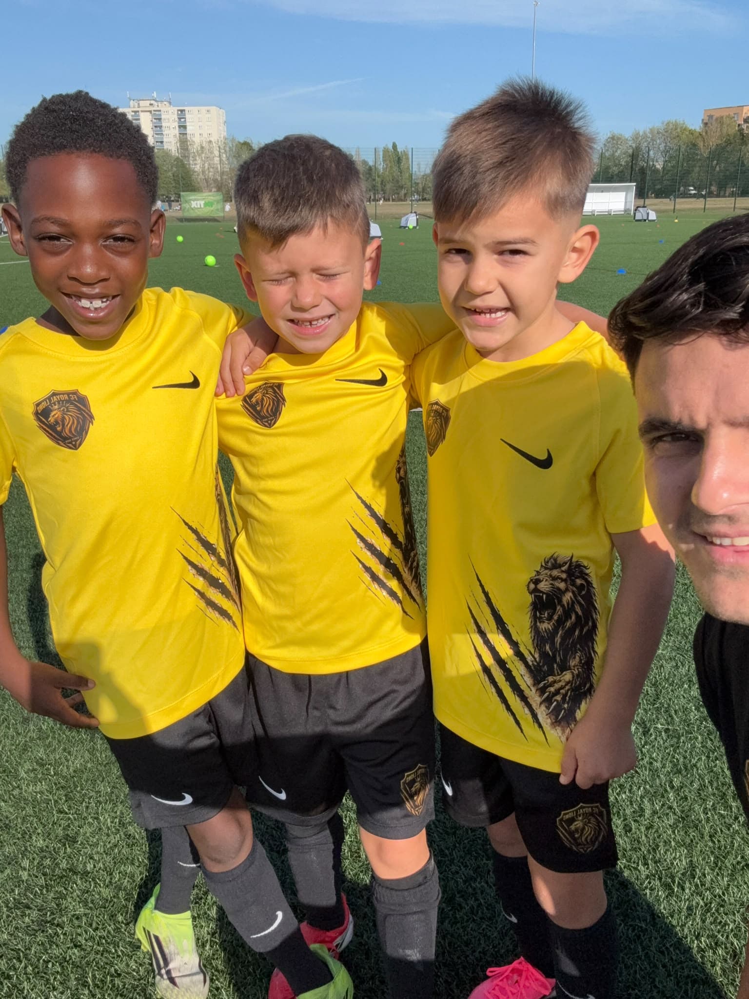 Coach with players in club kit